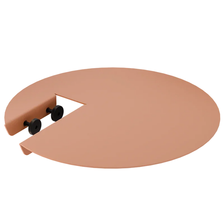 Runder peachfarbener Tischaufsatz mit Aussparung und schwarzen Schraubverschlüssen